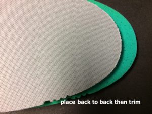 Place insoles back to back then trim